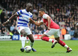Queens Park Rangers V Arsenal 2011-12 Prints: Arsenal's Oxlade-Chamberlain Faces Off Against QPR's Diakite (2011-12)