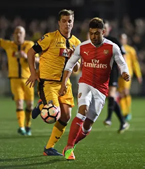 Sutton United V Arsenal 2016-17 Prints: Arsenal's Oxlade-Chamberlain Faces Off Against Sutton United's Collins in FA Cup Fifth Round Clash