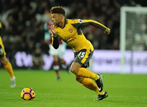 West Ham United V Arsenal 2016-17 Prints: Arsenal's Oxlade-Chamberlain Faces Off Against West Ham in Premier League Battle