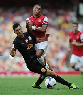 Arsenal V Galatasaray 2013-14 Prints: Arsenal's Oxlade-Chamberlain Fouls by Galatasaray's Gulselam - Emirates Cup 2013