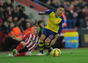 Southampton V Arsenal 2014-15 Prints: Arsenal's Oxlade-Chamberlain Outmaneuvers Southampton's Reed in Premier League Clash (January 2015)