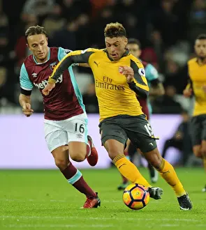 Olympic Stadium Prints: Arsenal's Oxlade-Chamberlain Outmaneuvers West Ham's Noble in Premier League Clash
