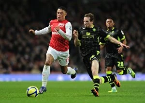 Arsenal v Leeds United FA Cup 2011-12 Collection: Arsenal's Oxlade-Chamberlain Outsmarts Leeds' White in FA Cup Showdown