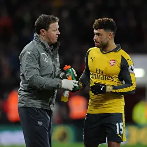 AFC Bournemouth V Arsenal 2016-17 Prints: Arsenal's Oxlade-Chamberlain Rehydrates Amidst AFC Bournemouth Battle (2016-17)