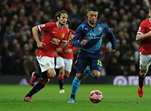 Arsenal's Oxlade-Chamberlain Tackles Manchester United's Blind in FA Cup Quarterfinal Showdown