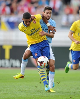 Arsenal V Manchester City Pre Season 2013-14 Prints: Arsenal's Oxlade-Chamberlain vs