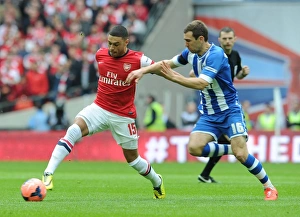 Arsenal V Wigan Athletic - FA Cup Semi Final 2014 Prints: Arsenal's Oxlade-Chamberlain vs. McArthur's Wigan: FA Cup Semi-Final Battle