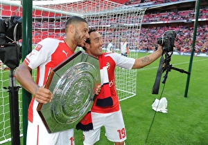 Arsenal V Manchester City - FA Community Shield 2014/15 Prints: Arsenal's Oxlade-Chamberlain vs Cazorla: A Pre-Season Rivalry - Arsenal vs Manchester City