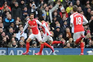 Tottenham Hotspur V Arsenal 2014-15 Prints: Arsenal's Ozil and Cazorla: Celebrating Glory Over Spurs in the 2015 Premier League