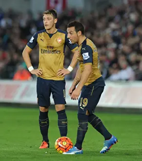 Swansea City V Arsenal 2015-16 Prints: Arsenal's Ozil and Cazorla Lock Horns in Swansea City vs Arsenal (2015-16)