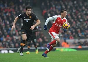 Images Dated 11th February 2017: Arsenal's Ozil Clashes with Hull's Maguire in Premier League Showdown