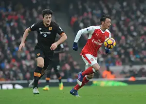 Arsenal V Hull City 2016-17 Prints: Arsenal's Ozil Clashes with Hull's Maguire in Premier League Showdown