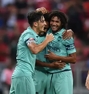 Arsenal's Ozil and Elneny: Celebrating a Goal Against Paris Saint-Germain in the 2018 Pre-Season Friendly