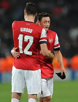 Arsenal V Napoli 2013-14 Prints: Arsenal's Ozil and Giroud Celebrate Goals Against Napoli in 2013-14 Champions League