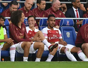 Arsenal's Ozil, Guendouzi, and Aubameyang in Action against Cardiff City