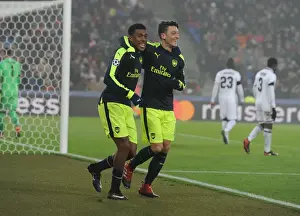 FC Basel V Arsenal 2016-17 Prints: Arsenal's Ozil and Iwobi Celebrate Goals Against FC Basel in 2016-17 UEFA Champions League