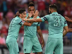 Arsenal's Ozil and Kolasinac Celebrate Goal Against Paris Saint-Germain, 2018