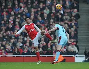 Arsenal V Burnley 2016-17 Prints: Arsenal's Ozil Outmaneuvers Burnley's Keane in Premier League Clash
