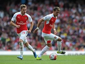 Arsenal v Stoke City 2015-16 Collection: Arsenal's Ozil and Ramsey in Action: A Premier League Duo at their Best