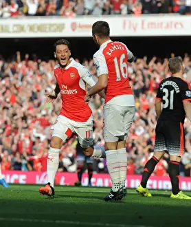 Arsenal's Ozil and Ramsey Celebrate Double Strike Against Manchester United (2015/16)