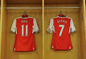 Arsenal V Everton 2016-17 Prints: Arsenal's Ozil and Sanchez Jerseys Hang in Empty Changing Room before Arsenal v Everton (2016-17)