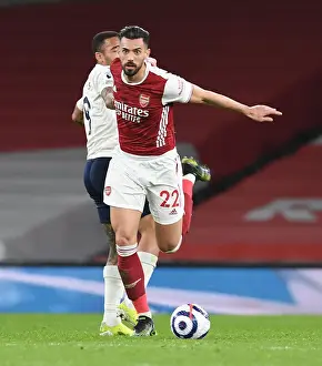 Arsenal's Pablo Mari Outmaneuvers Manchester City's Gabriel Jesus: A Battle at Emirates Stadium Amidst Pandemic Restrictions (Arsenal v Manchester City, 2021)