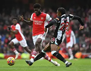 Arsenal V Newcastle United 2021-22 Prints: Arsenal's Partey Fends Off Willock in Intense Arsenal v Newcastle Clash
