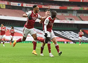 Arsenal's Pepe and Aubameyang Celebrate Goals Against Sheffield United in Empty Emirates Stadium
