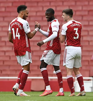 Arsenal v Brighton & Hove Albion 2020-21 Collection: Arsenal's Pepe and Aubameyang: Celebrating a Winning Duo in Arsenal's Victory Against Brighton