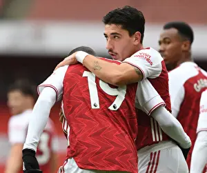 Arsenal's Pepe and Bellerin Celebrate Goals in Empty Emirates Stadium Against Sheffield United (2020-21)