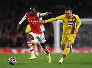 Arsenal V Crystal Palace 2021-22 Prints: Arsenal's Pepe Clashes with Crystal Palace's McArthur in Premier League Showdown