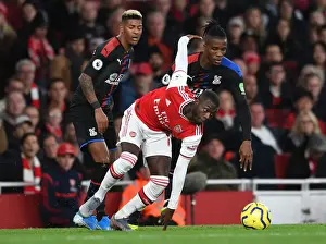 Arsenal V Crystal Palace 2019-20 Prints: Arsenal's Pepe Clashes with Palace's Van Aanholt and Zaha during the 2019-20 Premier League Match