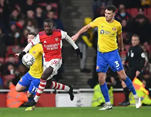 Arsenal's Pepe Clashes with Sunderland Defenders in Carabao Cup Quarterfinal