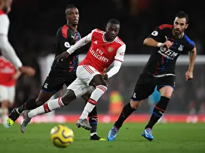 Arsenal V Crystal Palace 2019-20 Prints: Arsenal's Pepe Faces Pressure from Palace's Zaha and Milivojevic during Premier League Clash