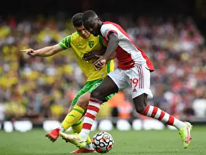 Arsenal's Pepe Fends Off Norwich's Rashica in Premier League Clash
