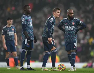 Arsenal's Pepe, Odegaard, and Lacazette in Action against Norwich City (Premier League 2021-22)