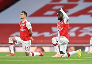 Arsenal V Liverpool 2019-20 Prints: Arsenal's Pepe Takes a Knee at Empty Emirates: Arsenal FC vs Liverpool FC