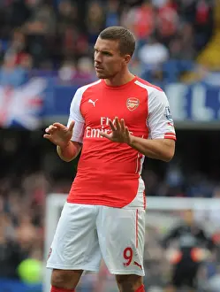 Chelsea V Arsenal 2014-15 Prints: Arsenal's Podolski Clashes with Chelsea at Stamford Bridge (2014-15 Premier League)