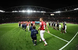 Arsenal's Podolski Readies for Olympiacos Clash at Emirates Stadium