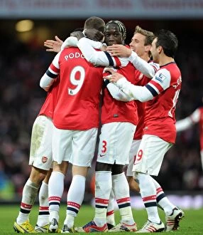 Arsenal v Stoke City 2012-13 Collection: Arsenal's Podolski, Sagna, and Cazorla Celebrate Goal Against Stoke City (2013)