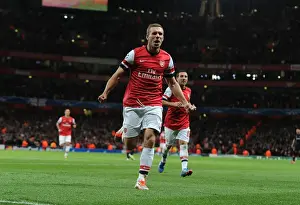 Arsenal V Olympiacos 2012-13 Prints: Arsenal's Podolski Scores Brace: Champions League Victory Over Olympiacos (2012)