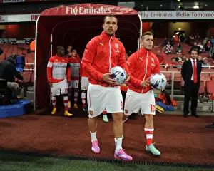 Arsenal V Southampton, League Cup 2014/15 Prints: Arsenal's Podolski and Wilshere Prepare for Arsenal v Southampton in League Cup Showdown