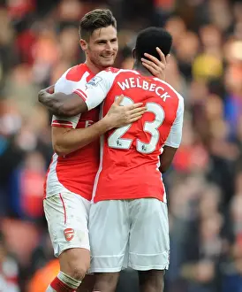 Arsenal's Premier League Victory: Giroud and Welbeck Celebrate with Arms Raised