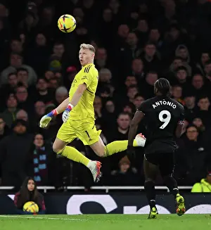 Arsenal's Ramsdale Fends Off West Ham's Antonio: A Headed Battle in the Premier League
