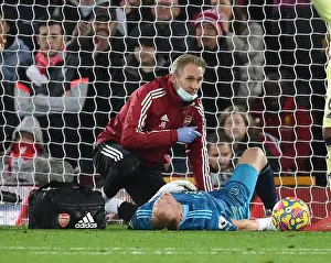 Arsenal's Ramsdale Receives Medical Attention Amidst Intense Liverpool Clash