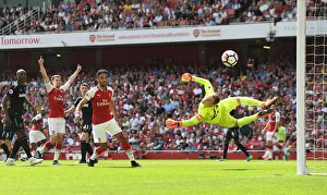 Arsenal's Ramsey and Aubameyang vs. West Ham's Hart: Intense Moment from the Premier League Clash