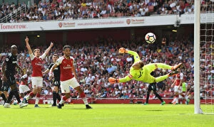 Arsenal v West Ham United 2017-18 Collection: Arsenal's Ramsey and Aubameyang vs. West Ham's Hart: Intense Moment from the Premier League Clash