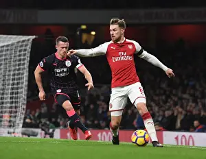 Arsenal V Huddersfield Town 2017-18 Prints: Arsenal's Ramsey Clashes with Huddersfield's Hogg in Premier League Showdown