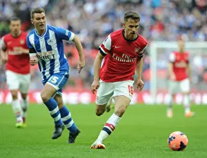 Arsenal V Wigan Athletic - FA Cup Semi Final 2014 Prints: Arsenal's Ramsey Clashes with Wigan's McManaman: FA Cup Semi-Final Battle