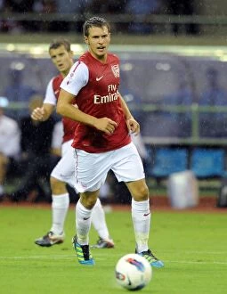 Hangzhou Greentown v Arsenal Collection: Arsenal's Ramsey and Nasri Face Off in 2011 Pre-Season Friendly in Hangzhou, China
